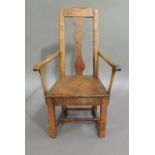 A primitive elm elbow chair with arched top rail, shaped pine splat, bordered seat and rudimentary