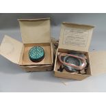 A pair of boxed vintage respirators, one in cotton carrying case (rubber perished)