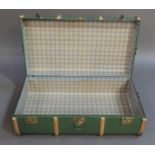 A Cheney wooden and metal bound green fabric trunk, 92cm wide