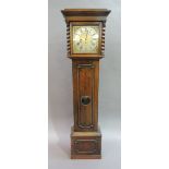 An oak cottage long case clock circa 1920's the flared hood enclosing a brass dial with silver