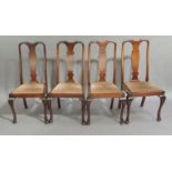 A set of four mahogany queen Anne style dining chairs with shaped baluster splats, drop in seats