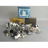 A quantity of Britains painted animal figures etc; together with three tin boxes including