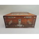A late Regency rosewood and mother of pearl inlaid work box of sarcophagus shape, with side brass