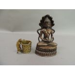 A reproduction bronze Buddha seated in typical pose before a cobra back, 20cm high; together with
