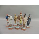 A set of seven painted plaster figures of Indian peasants and aristocrats, circular bases, 12cm high