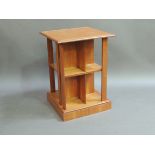 A stained pine two tier desk the top with super structure above single drawer square legs and an