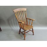 A late 19th century ash and elm high back kitchen chair the concave cresting rail above five