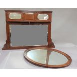 An oak oval framed mirror with bevelled plate, 80cm wide; together with a mahogany over mantel