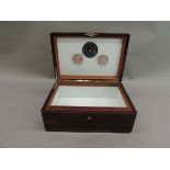 A mahogany humidor with silver strapwork mounts, the hinged lid with cartouche inscribed 'To Whitney