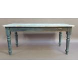 A reproduction kitchen table the pale blue and white painted rounded rectangular top above an