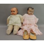 A vintage celluloid doll with stuffed felt body, contemporary clothes, 44cm high; together with