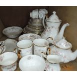 A Royal Albert Victoriana Rose tea service comprising plates, cups, saucers, bowls, mugs, teapot,