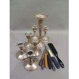 Three pairs of silver dwarf candlesticks, 11cm high and smaller; together with a silver spills vase,