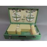 A 1950/60's vintage picnic hamper with Brexton pottery plates transfer printed with gondolas and