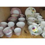 A Czechoslovakian part tea service printed in gilt on a pink band with stylised flowerheads and