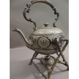 A Victorian silver plated tea kettle on stand, the body with arched bead cast scroll handle with