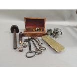 A Victorian brass cribbage board, four vintage keys, vintage pewter measures, a scribe and a Stanley