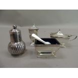 A three piece condiment set of Art Deco style comprising lidded mustard, salt and pepperette, by D