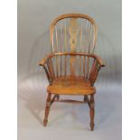 late 19th century ash and elm high back kitchen Windsor elbow chair with pierced splat flanked by