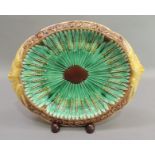 A Victorian majolica dish of two handled oval form, the centre with corn stooks, the border