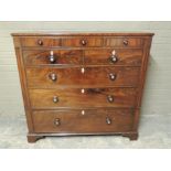 An early 19th century mahogany chest of drawers, the rectangular top with moulded lip above three