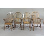 Four similar high back Windsor elbow chairs, ash and elm with pierced splats flanked by spindle