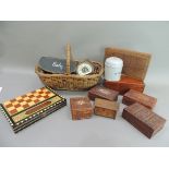 A wicker basket, a creproduction tin string box, bone inlaid carved wooden boxes, a pair of
