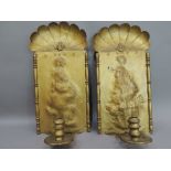 A pair of late 19th century gold painted girandoles with shell tops the rectangular panels