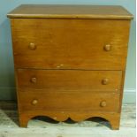 A Victorian pine mule chest having a lift up top with dummy drawer front above two drawers with