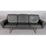 GEORG THAMS, DENMARK, three seater black leather and chrome sofa on twin pedestal and fin supports,