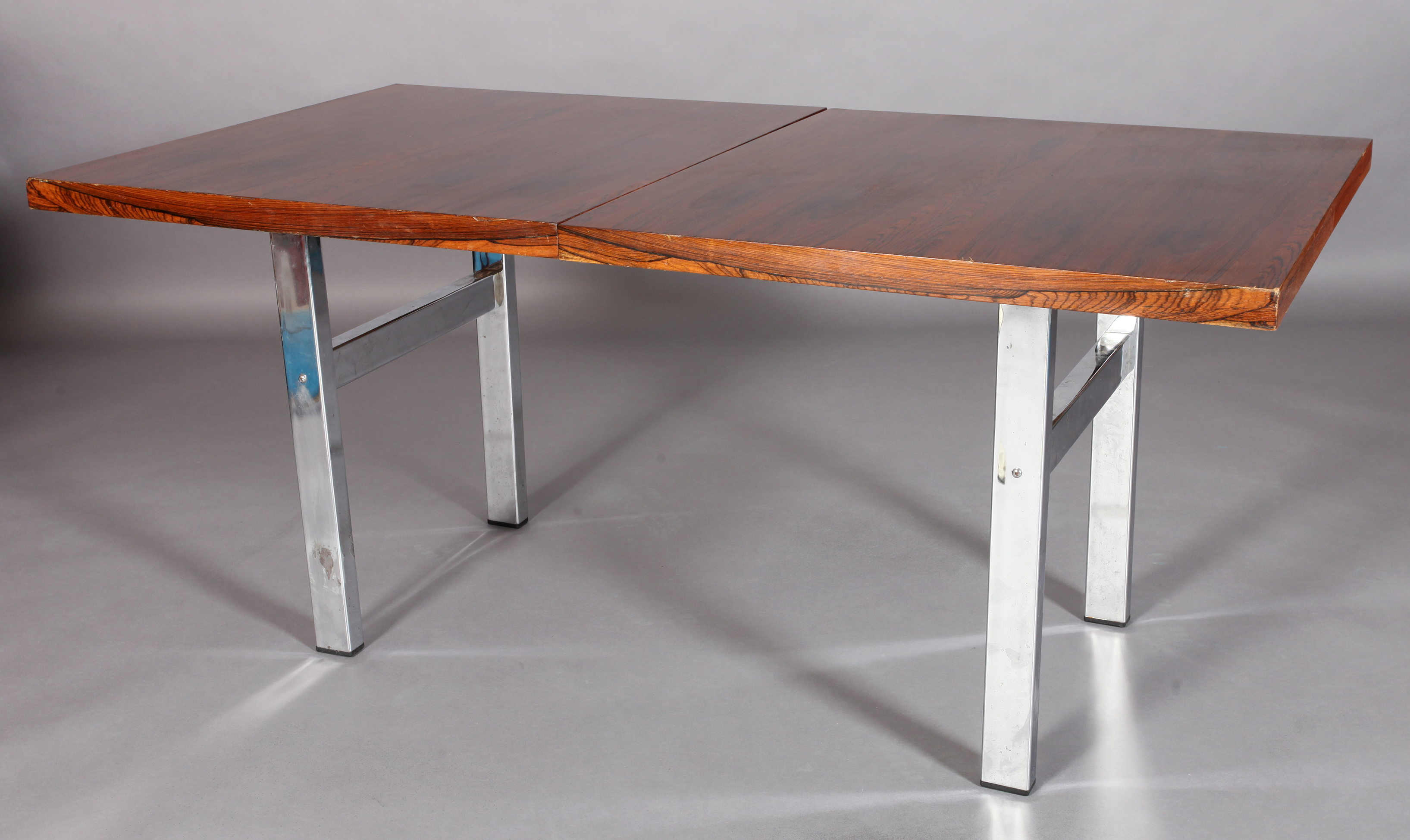 MERROW ASSOCIATES, BRITAIN, c.1970s, a rosewood extending dining table, rectangular, on refectory