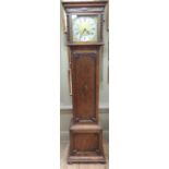 An oak cased grandmother clock having a brass style with silvered chapter ring, black Roman numbers,