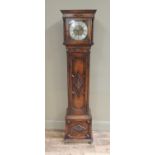 A 1930s grandmother clock having a brass dial with silvered chapter ring, black Roman numerals,