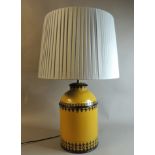 A modern Toleware table lamp in mustard and black, approx 48cm to fitting, with shade