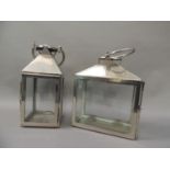 Two white metal and glass four panel lanterns of square and rectangular outline, 36cm high and