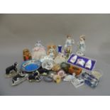 Various ornaments including two china half dolls, Russian doll, a pair of china figures, another