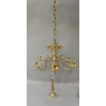 A late 17th century style brass chandelier with baluster cast column and pierced top gallery