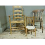An ash ladder back chair with rush seat turned legs joined by double stretchers; together with a