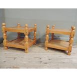 A pair of reproduction pine two tier square tables with ball finials, 50cm wide