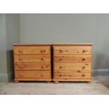 A pair of reproduction pine chests of four long drawers, turned feet, turned wooden handles, 76cm