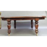 A reproduction mahogany extending dining table in Victorian style, the oval top with moulded lip