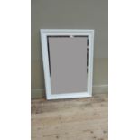 A white painted wall mirror with bevelled plate, 104cm x 74cm