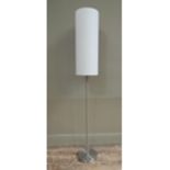 A brushed steel standard lamp with tall cylindrical white shade, 150cm high; together with a
