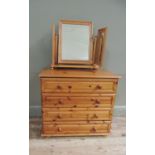 A reproduction pine chest of four long panel drawers, 77cm wide 70cm high; together with a