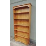A reproduction pine open bookcase, 84cm wide x 186cm high