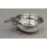 A silver tasse vin, 13cm wide over handle by HS Ltd, Sheffield 1896, approximate weight 2oz