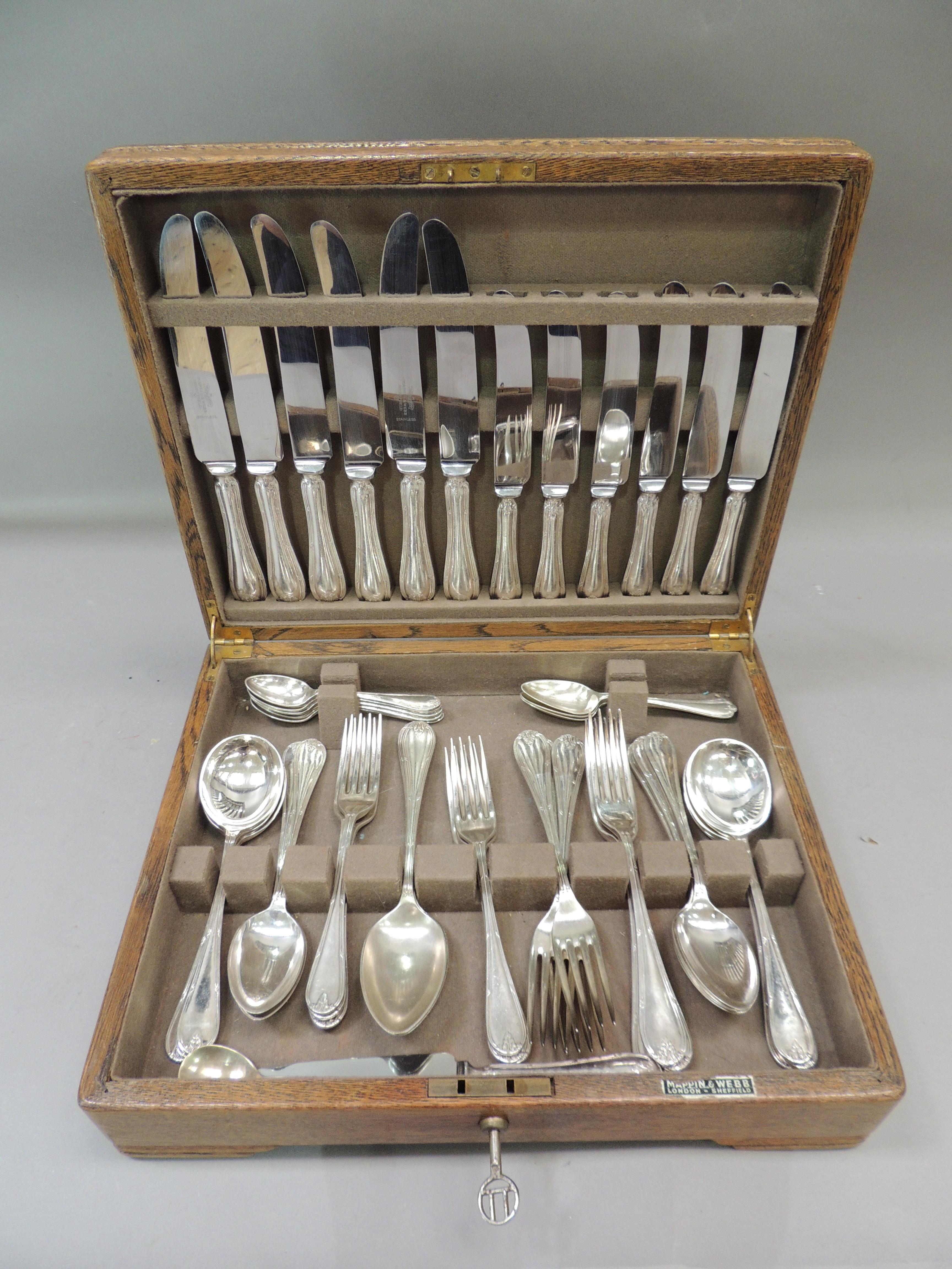 A quantity of Mappin and Webb silver plated table cutlery in oak canteen