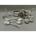A quantity of silver plated ware to include six division toast rack, dessert spoon, sauce boat and