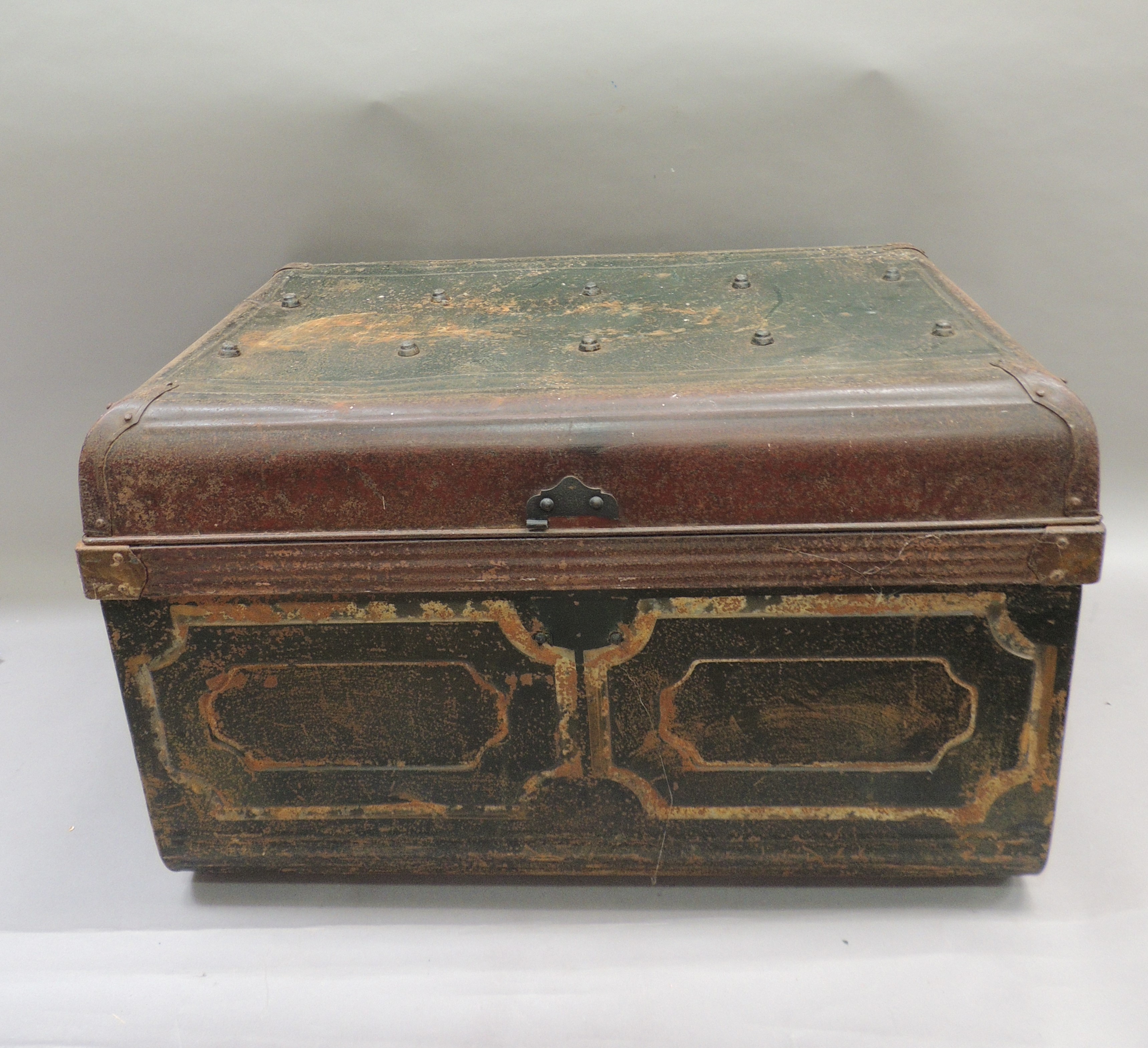 A green and brown japanned tin trunk, 74cm wide