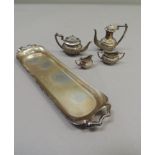 An Elizabeth II five piece miniature tea service in George V style comprising coffee pot, teapot,